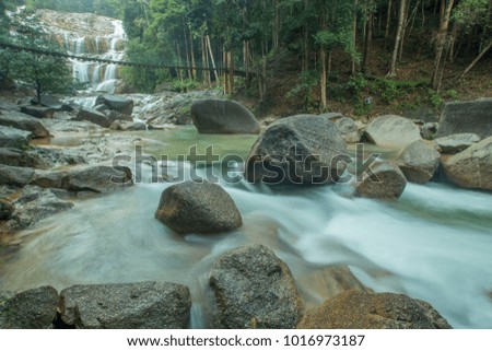 The scenery in the waterfall area in the tropical rainforest in Kuantan, Pahang, Malaysia.visible water secretion and noise