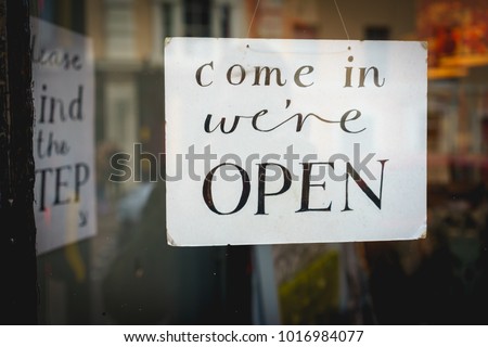 Open sign on a window shop . Landscape format.