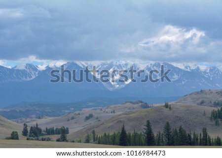 Snowy peaks of the mountains. Royalty-Free Stock Photo #1016984473