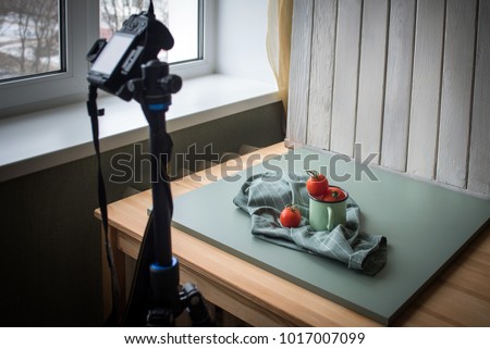 Food photography set up at home next to the window with a camera on tripod