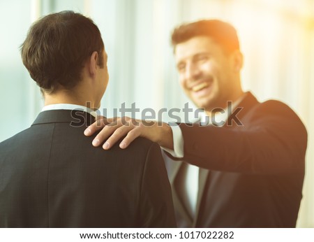 The smile businessmen pat on the shoulder Royalty-Free Stock Photo #1017022282