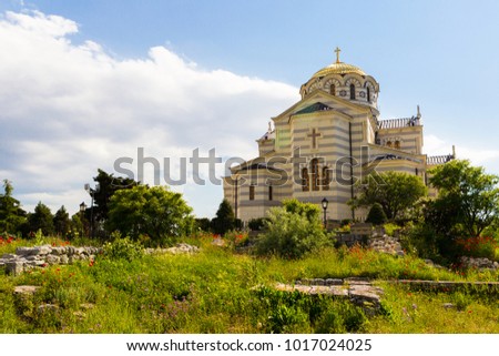 Vladimirsky temple in Chersonese Taurian, Sevastopol, Crimea, Russia, sunny day and blooming poppies