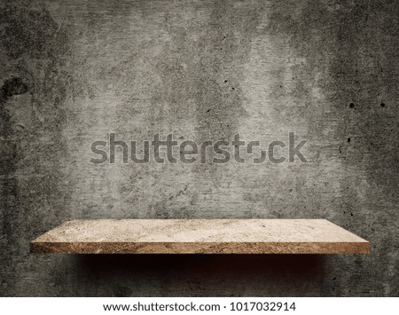 Empty Creamy rock shelf on gray cement wall