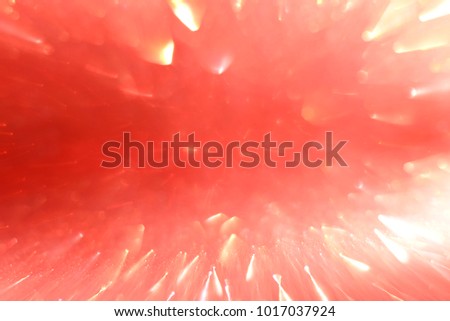 Glittering light that is moving on a bright red background.