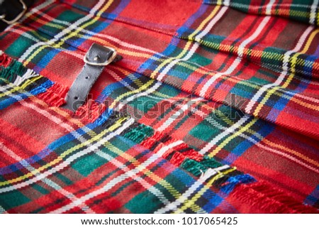 red scottish kilt textile detail with belt