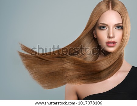 Beautiful model girl with shiny brown and straight long hair. Keratin  straightening. Treatment, care and spa procedures. Smooth hairstyle Royalty-Free Stock Photo #1017078106