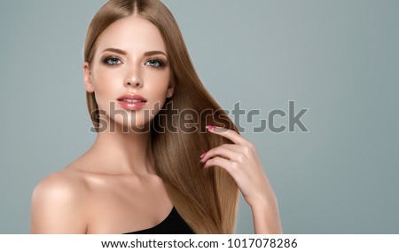 Beautiful model girl with shiny brown and straight long hair. Keratin  straightening. Treatment, care and spa procedures. Smooth hairstyle Royalty-Free Stock Photo #1017078286