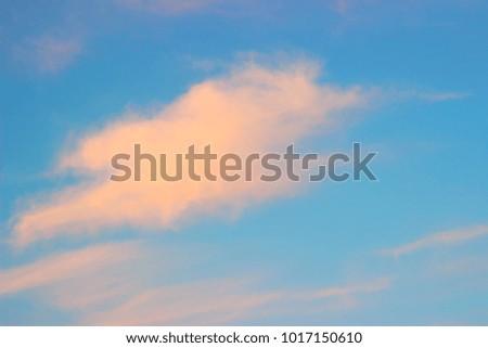 Orange clouds on blue sky
