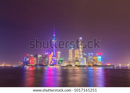 Illuminated Panoramic Shanghai Skyline at Night. Lujiazui Financial District and Huangpu River. View from The Bund Embankment. China.