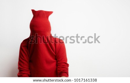 Portrait of woman wearing a red sweater stressed because work isolated on white background. Businessman concept