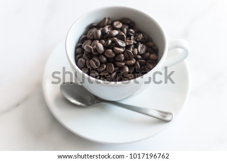 This stock photo of coffee beans in a white coffee cup is a great background for your blog post or shop announcement. Use this stock photo to caffeinate your social media feed.