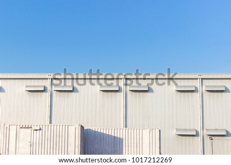 Factory Industrial metal building with metal sheet container office and blue sky