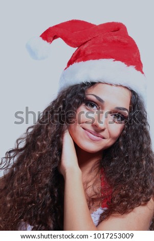 Beautiful happy woman in Santa Claus clothes.