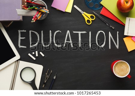 Word education written on black chalkboard and frame of different things. Conceptual education background with copy space. Inspiration and creativity backdrop, top view