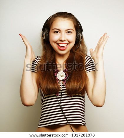 Young woman listening to music. Happy and headphones. Lifestyle concept.