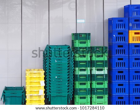 Close up to plastic baskets colorful baskets wall background. Royalty-Free Stock Photo #1017284110
