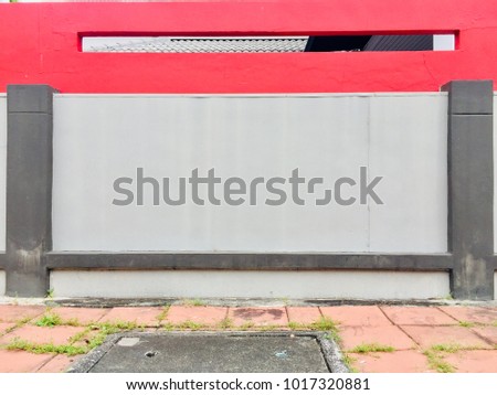 Modern style wall, hole red block above cement wall.