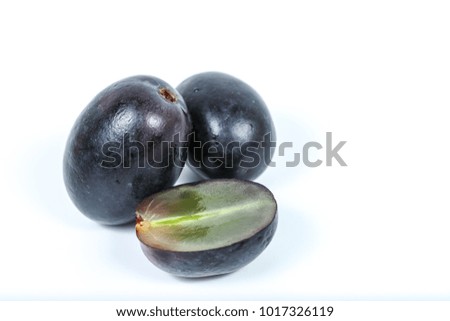 Fresh, ripe dark grapes, isolated on white background