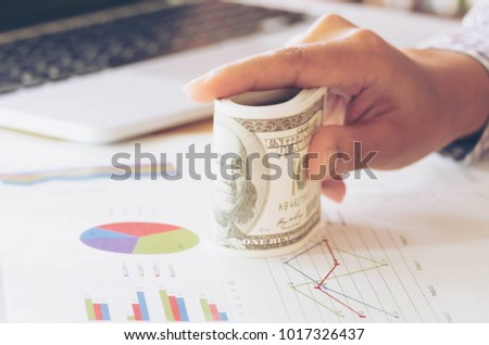 Dollars Banknote Currency Business Concept, Entrepreneur or Startup Easy and Success to Make Money or Profit. Hand Holding Money for Counting on Table.