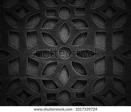 Macro texture. Fragment black lace leather background.