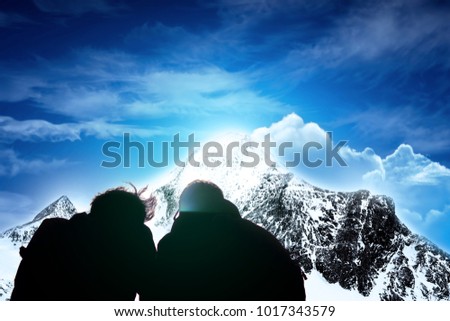 Backlight friendship pose, mountain background