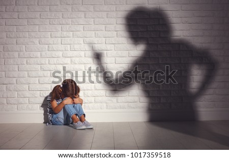 domestic violence. angry mother scolds   frightened daughter sitting on floor
 Royalty-Free Stock Photo #1017359518