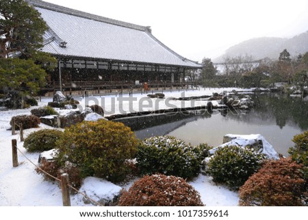 Buddhism temple in snow in Kyoto , Japan.
