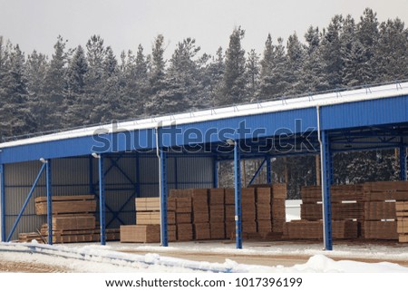 Lumber warehouse.New Stacked pallets .