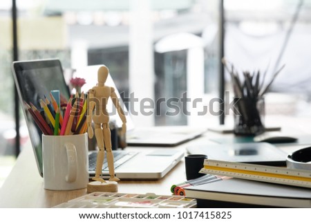 artist workplace with office supplies object on desk.