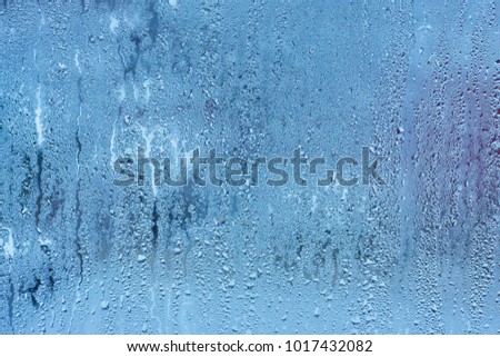 Natural background with condensation on the windows , high humidity , hot water vapor
