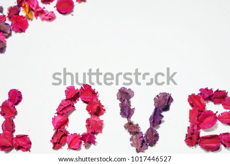 Valentine's day background. love spelled with flowers on white background. love concept. happy day. mothers day. valentines day card. anniversary. copy space