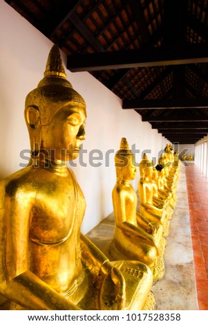 Golden Buddhism statues at the temple in Thailand