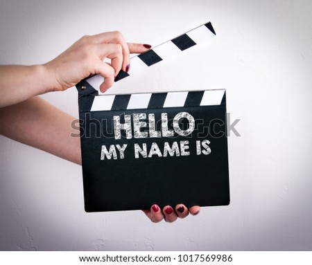 Hello My Name Is. Female hands holding movie clapper 