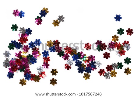Colorful flower confetti isolated on white background, top view