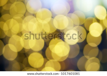 abstract defocused gold bokeh or bubble from light party on stage at night for background and christmas festival