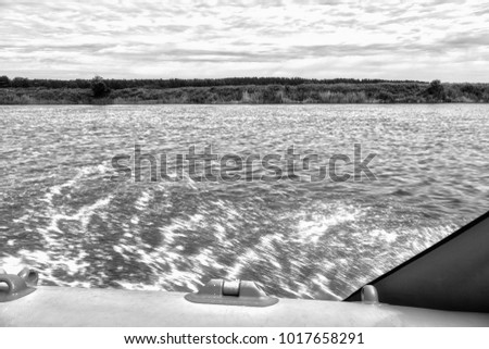 The view from the boat to the river Bank in black and white