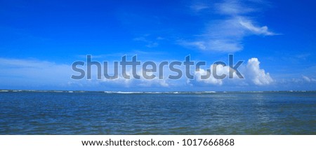 Beautiful tropical seascape and blue sky. Panorama of sea waves.