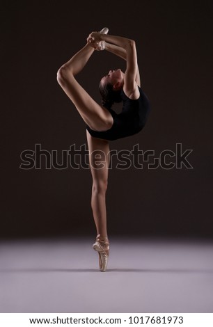 Ballerina in leotard. Photo in color.