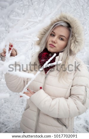 Beautiful young girl outdoors in the snow wearing hood - Stock image
Winter, Women, Girls, Child, People
