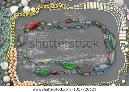 Decorative background for text. Empty picture frame jewelry on a painted wooden background. Top view Flat lay