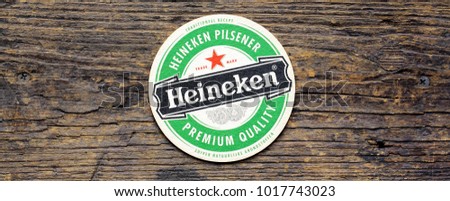 AMSTERDAM, HOLLAND - April 2, 2017.: Beer mats from Heineken Lager Beer in vintage background , it was first brewed by Gerard Adriaan Heineken in 1873 Royalty-Free Stock Photo #1017743023