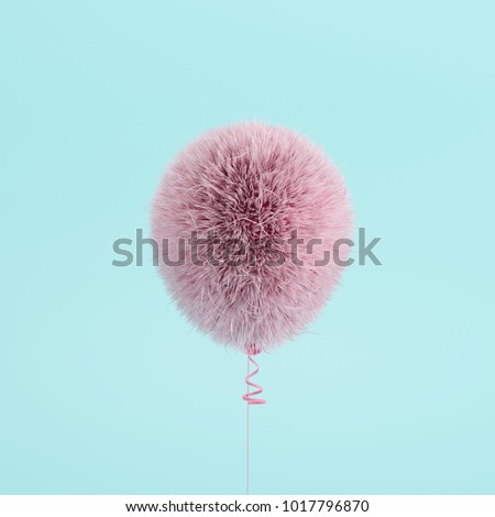 Pink Balloon Fur floating on blue background. minimal concept idea.