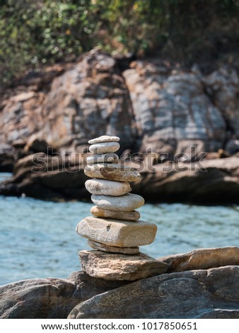 Stacking Stones On Beach
