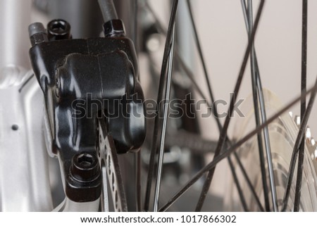 Hydraulic rear disc brake of mountain bike, close up view, studio photo. 