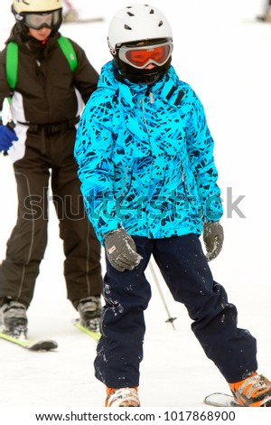 BUKOVEL, UKRAINE - FEB 4, 2018: Unidentified little boy does skiing in Bukovel, the largest ski resort in Eastern Europe
