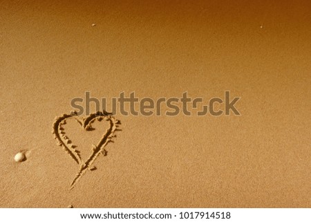 Valentine's day. Heart on the sand backgrounds