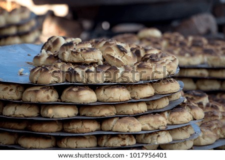 Image of fresh prepared biscuit getting out from oven 