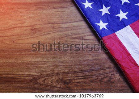 USA Flag on Brown Wooden Board. America Flag Background with Copy Space for MLK Day, President's Day, Patriot Day, 4th of July, Independence Day. 