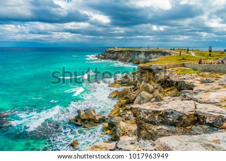 Beautiful view of rocky cliff at sunrise on the the southern part of the Isla Mujeres in Caribbean, Mexico Royalty-Free Stock Photo #1017963949