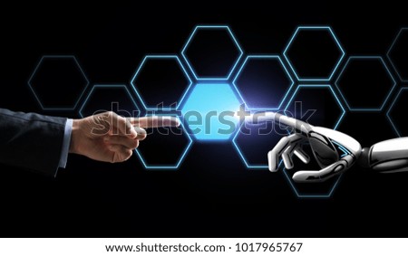 future technology, artificial intelligence and business concept - robot and human hand touching virtual network hologram over black background